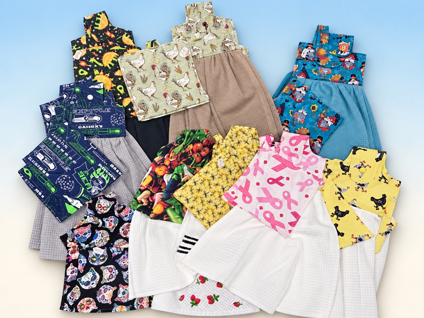 Sewn fabric pouches and towel dresses with sports, holiday, and floral prints by Cheryl Travis